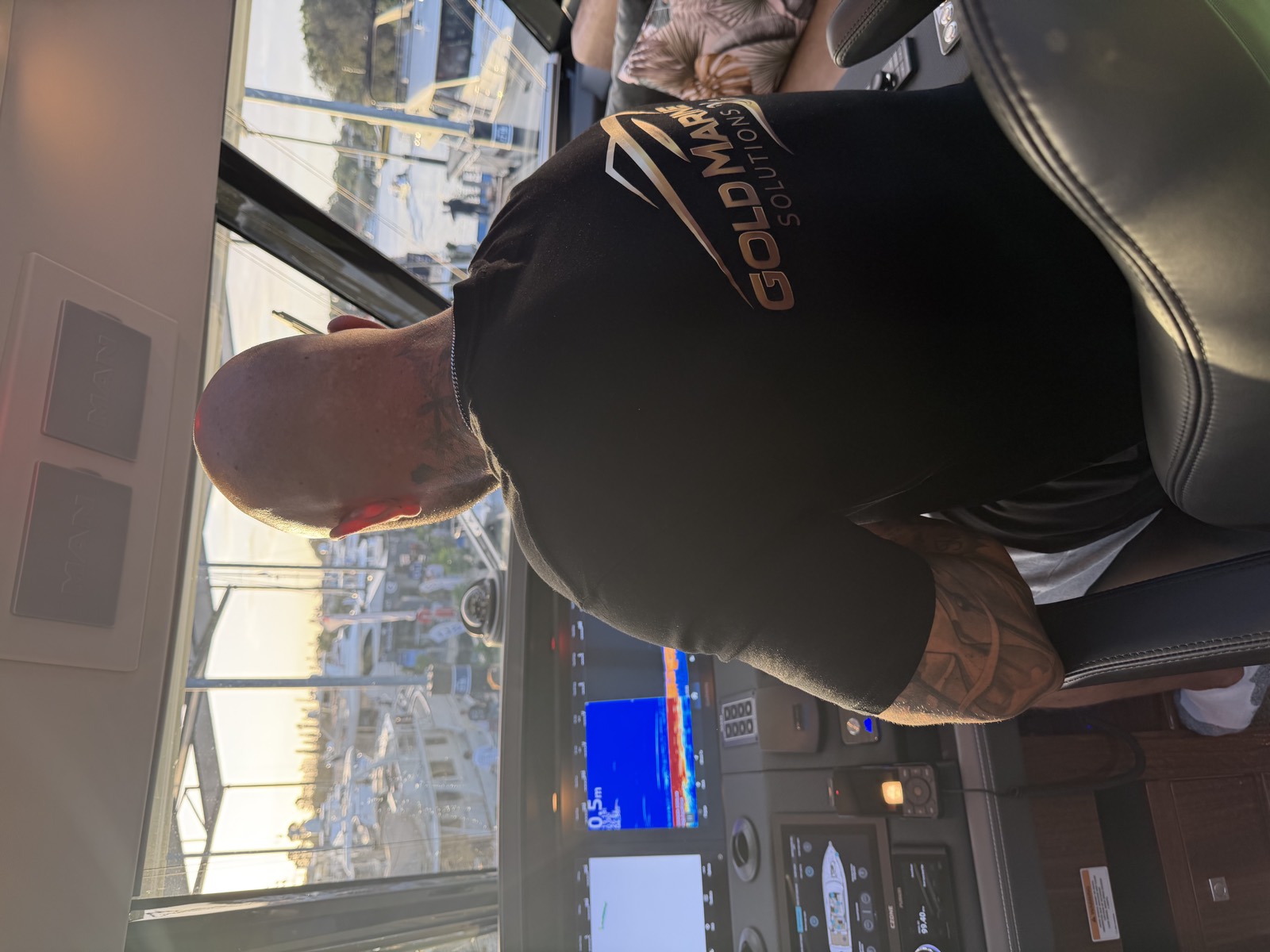 At the helm of a motor yacht on the Gold Coast