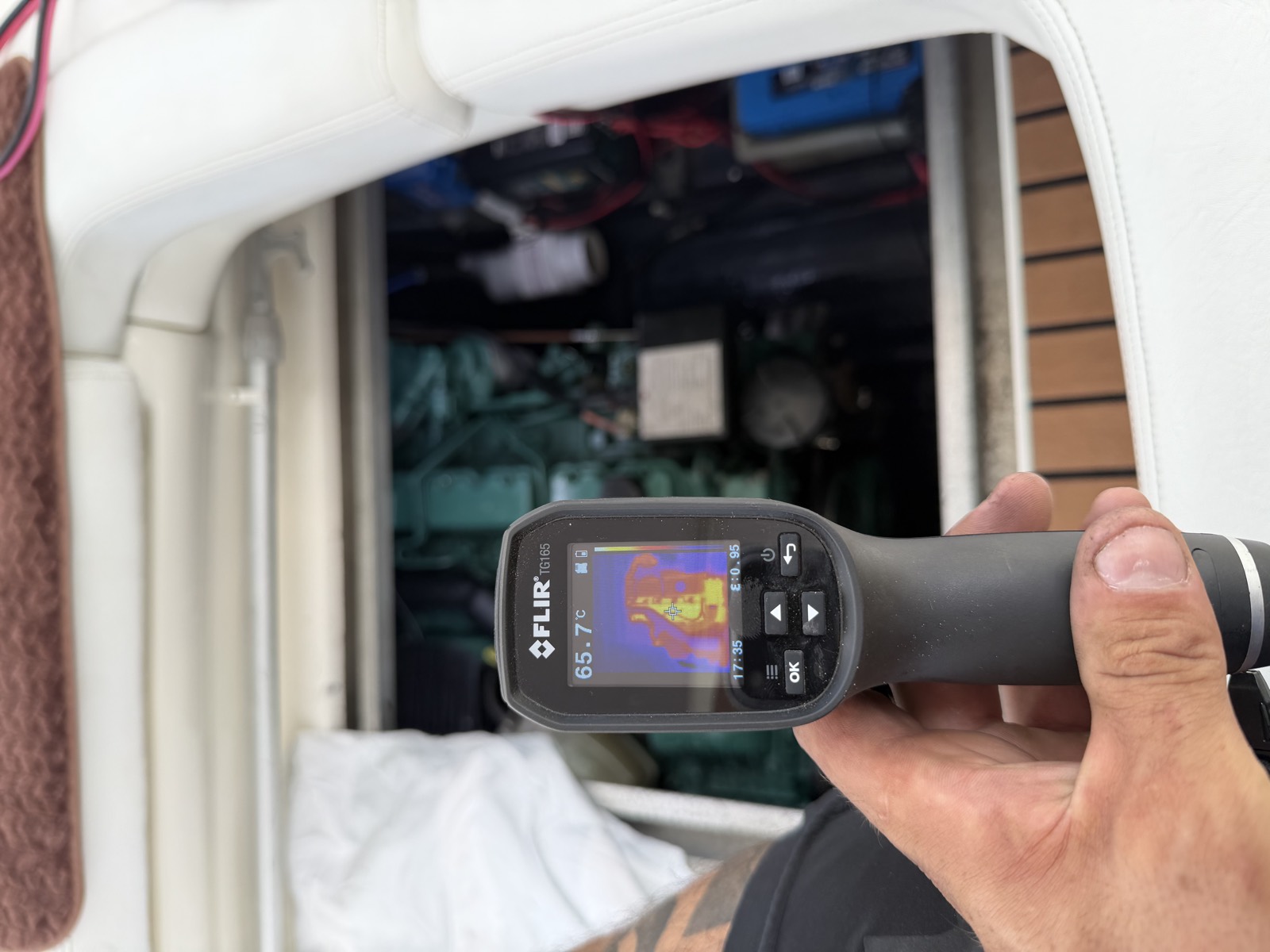 Thermal imaging camera in use over an open engine bay during an inspection