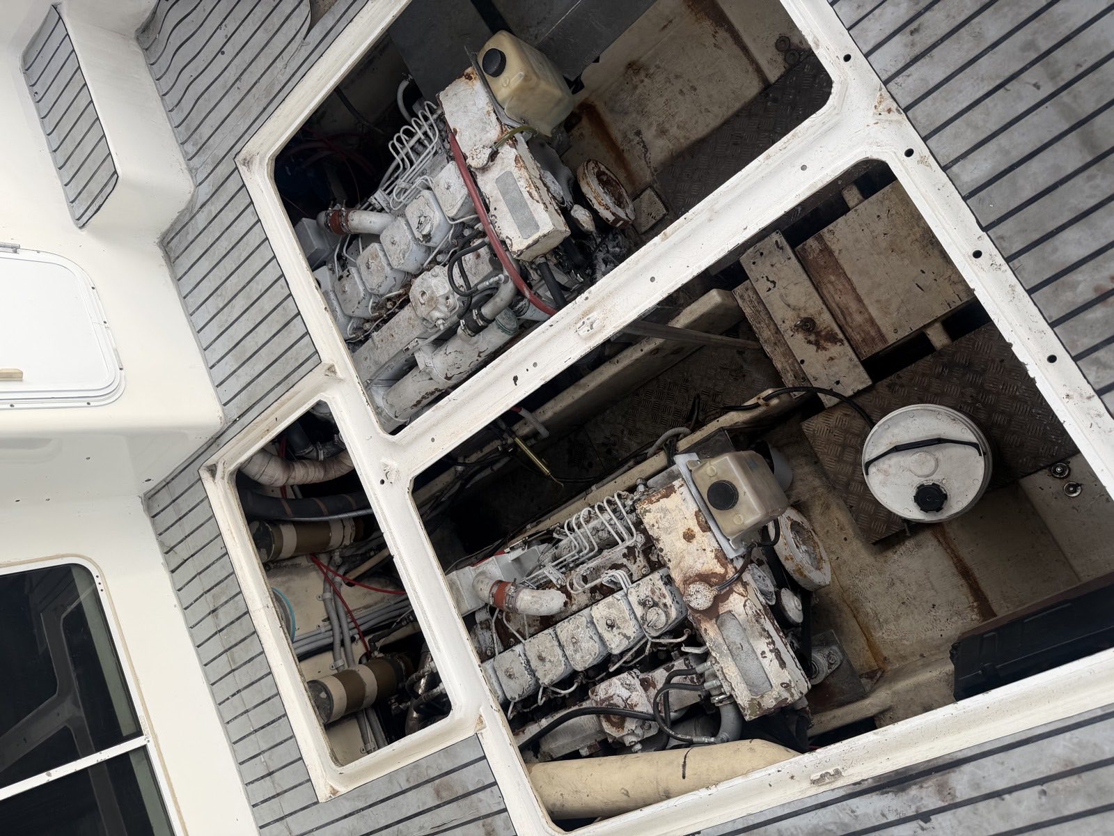 Twin marine diesel engines in open deck hatches