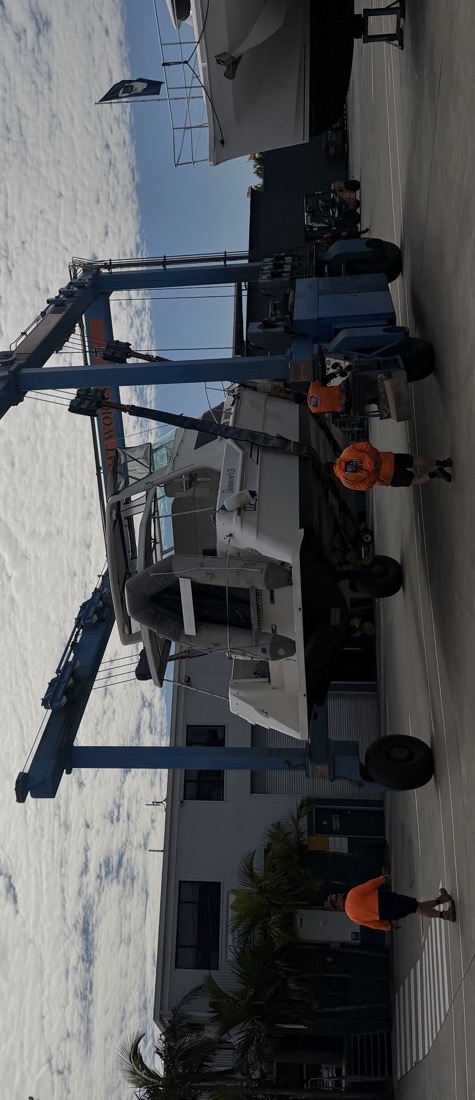 A 35ft Chris-Craft Commander 3500 in the travel lift at the boatyard