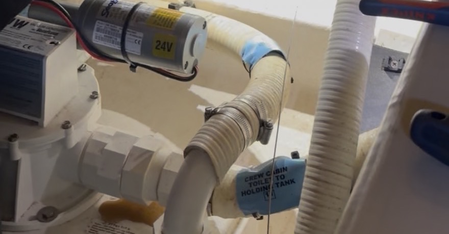 Marine sanitation vacuum generator with its 24V pump and discharge line
